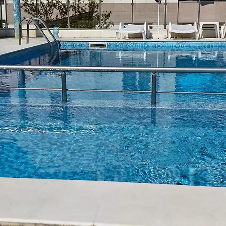 With Free Pool And Parking Space